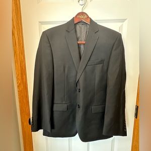 Men’s black wool dress jacket by Calvin Klein. Slim fit, 36S